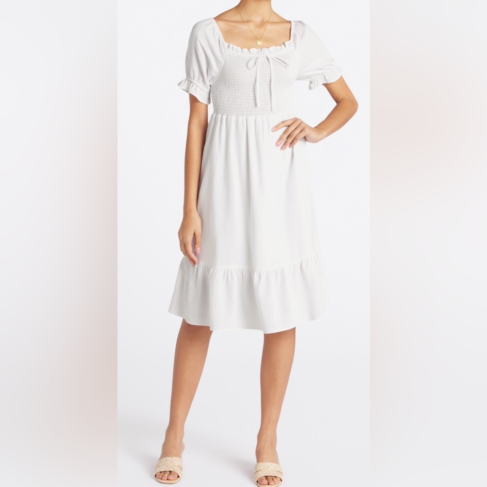 Kaileigh Ali Smocked Puff Sleeve dress.